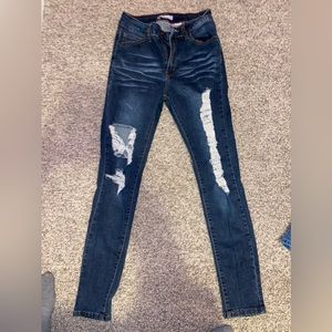 Dark wash skinny jeans with rips